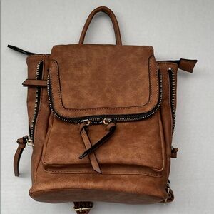 NWT Brown Faux Leather Small Backpack
Front Zipper & Snap Closure 
Gold Accents